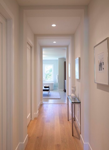 Recessed lighting produces a bright light with an unobtrusive, slightly modern appearance (by Charlie & Co. Design, Ltd)