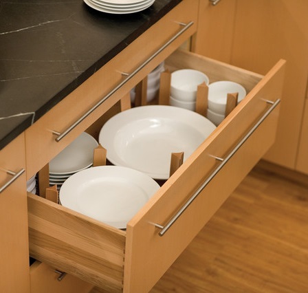 Segmented drawers can store a full set of dinnerware in less space than a traditional cabinet, and keep individual pieces better sorted (by Dura Supreme Cabinetry)