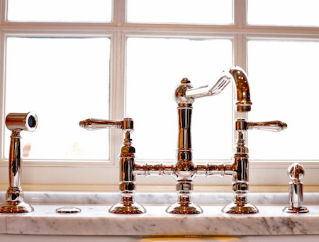 The bridge faucet is a popular style for vintage and farmhouse sinks. By Kitchen Kraft.