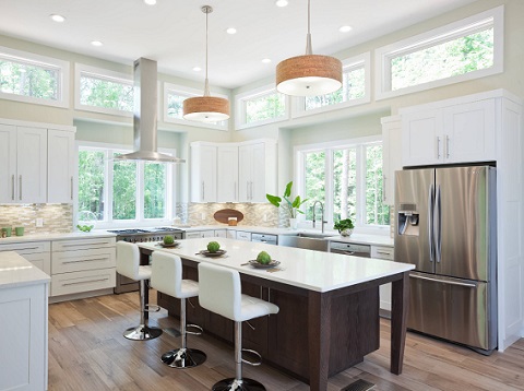 Replacing a single bright lighting fixture with lots of smaller ones spaced evenly throughout the room will give you better over-all illumination and help combat the shadowy corners of your kitchen (by Turan Designs)