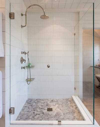 Glass-enclosed showers are sleek, stylish, and clean. (By Jonathan Raith Inc., photo by Nantucket Architectural Photography)