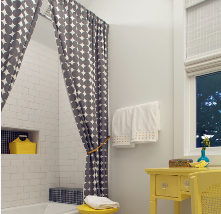 Spice up a combined shower/bath with a trendy shower curtain. (By Rethink Design Studio) 