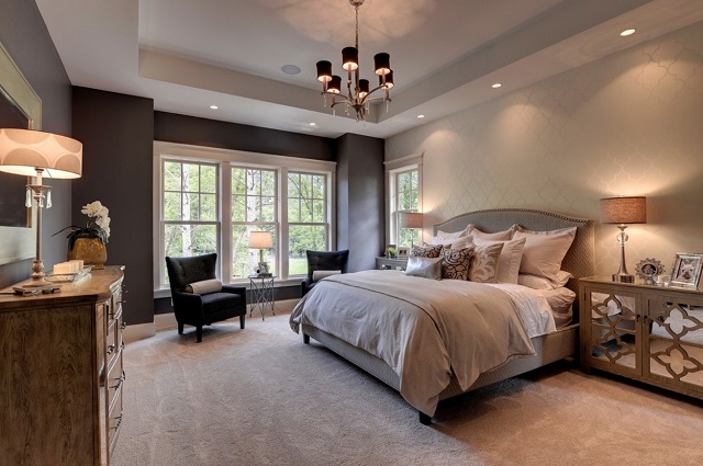 Recessed lighting gives you soft, diffuse, dimmable light above your bed, and can add a great layer of lighting throughout your bedroom (by Highmark Builders)