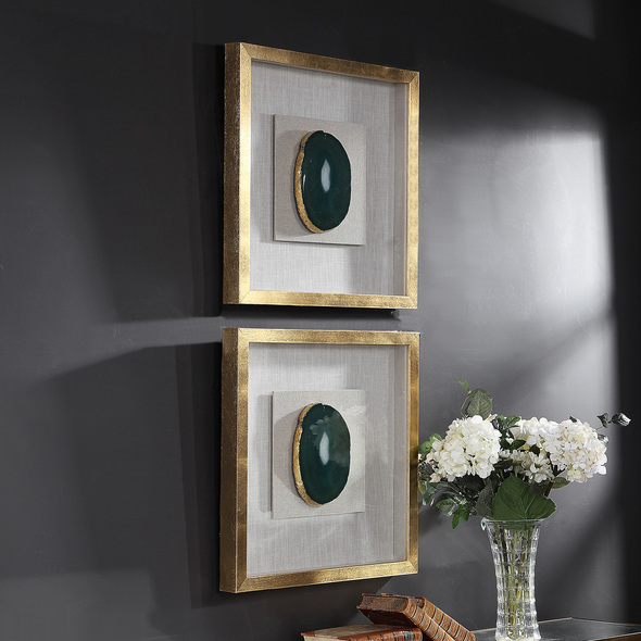  Uttermost Shadow Box Boxes and Bookends A Pine Wood Shadow Box Featuring A Hand Applied Gold Leaf Finish Showcases A Striking Emerald Green Agate Stone With White Veining, Accented With Hand Painted Gold Edging. Mounted On An Off White Linen Backing.