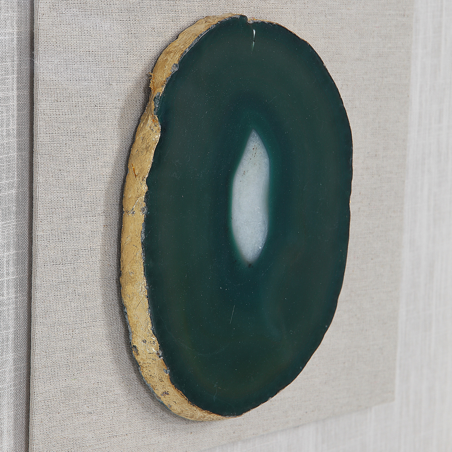  Uttermost Shadow Box Boxes and Bookends A Pine Wood Shadow Box Featuring A Hand Applied Gold Leaf Finish Showcases A Striking Emerald Green Agate Stone With White Veining, Accented With Hand Painted Gold Edging. Mounted On An Off White Linen Backing.